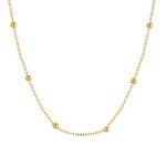 Gold necklace with small beads on a white background
